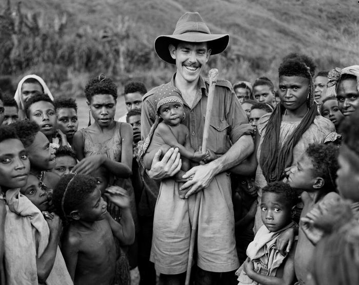 HistPOM-22-1948.jpg - Villagers pose with Patrol Officer David Cameron during a dental patrol, Papua New Guinea, 1948. Photographer: James (Jim) Fitzpatrick (source: Natioal Archives of Australia; http://www.naa.gov.au/collection/snapshots/on-patrol-in-papua-new-guinea/sogeri-barracks.aspx; accessed: 4.2.2013)