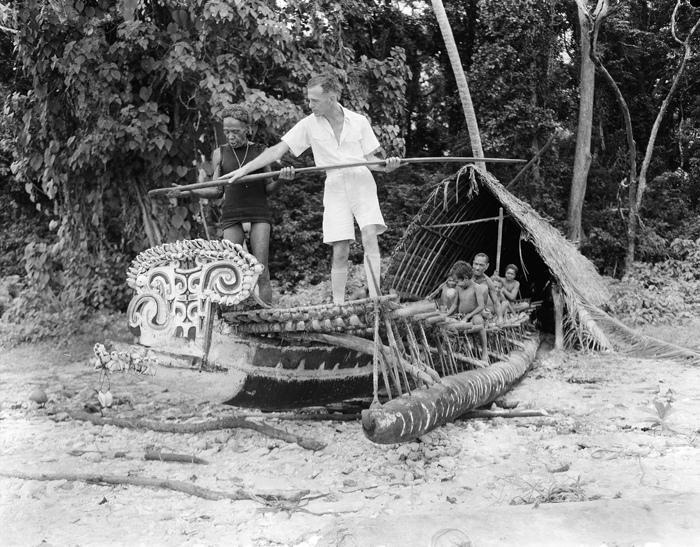 HistPOM-23-1948.jpg - A patrol officer checking a native canoe, New Guinea, 1948. Photographer: James (Jim) Fitzpatrick (source: National Archives of Australia; http://www.naa.gov.au/collection/snapshots/on-patrol-in-papua-new-guinea/sogeri-barracks.aspx; accessed: 4.2.2013)