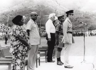 HistPOM-53aa_Post_Courier20130918.png - For the last time the Australian flag came down at the Sir Hubert Murray Stadium in Konedobu, Port Moresby, 15 September 1975. (left-right) Lady Guise, PNG Governor General Sir John Guise, Australian Governor General Sir John Kerr and Prince Charles (source: Post-Courier September 18, 2013).